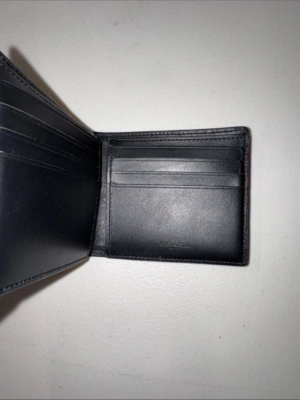 Coach Black Leather Bi-Fold Wallet with Multicolor 'Coach New York' Logo